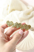 Barrette 5 cœurs paillettes dorées