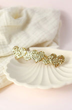 Barrette 5 cœurs paillettes dorées